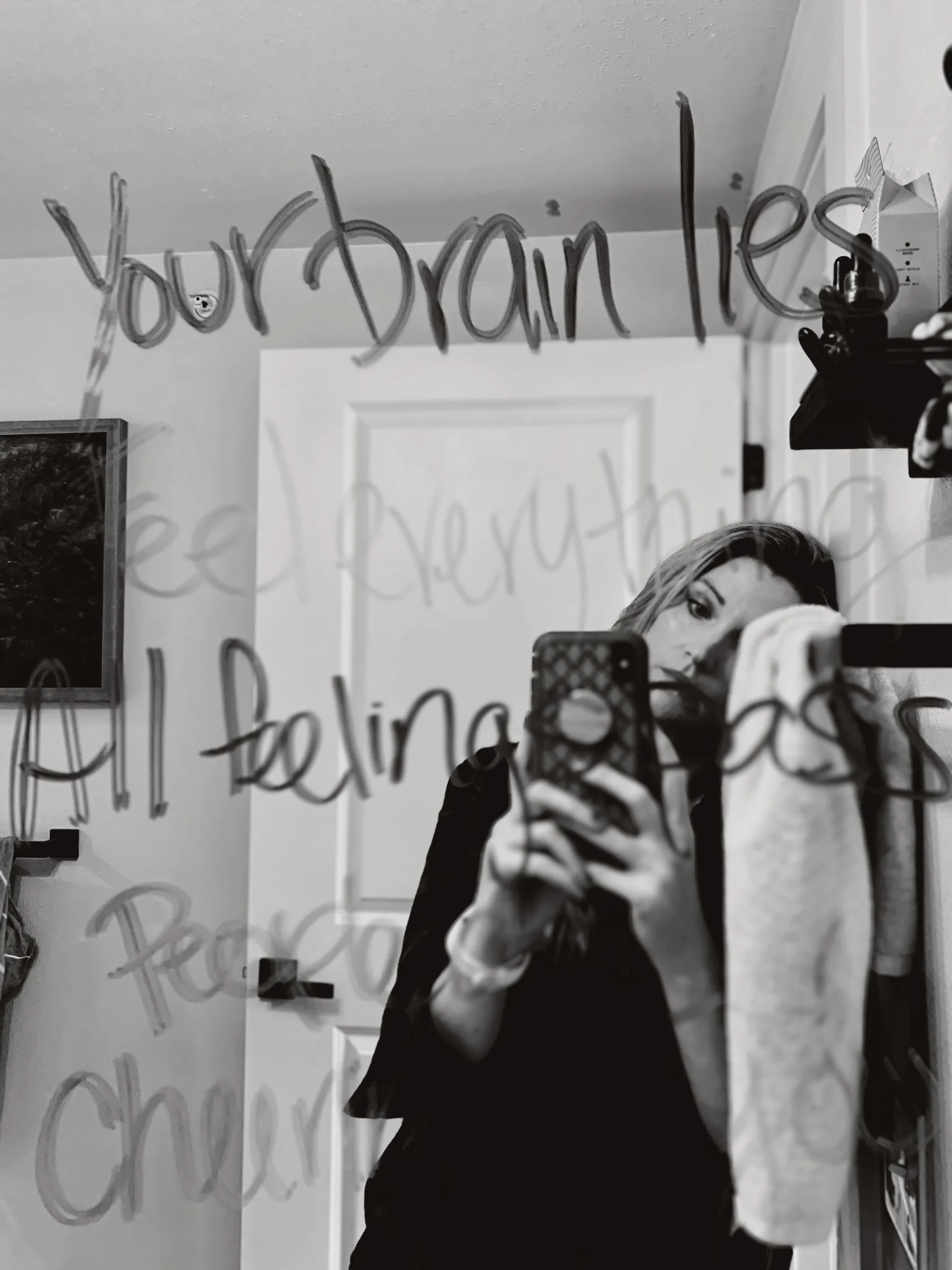 Looking at a mirror with affirmations written on it in dry erase marker