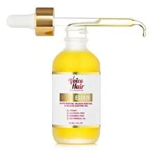 Voice Of Hair Elixir with Dropper laid out on top of bottle