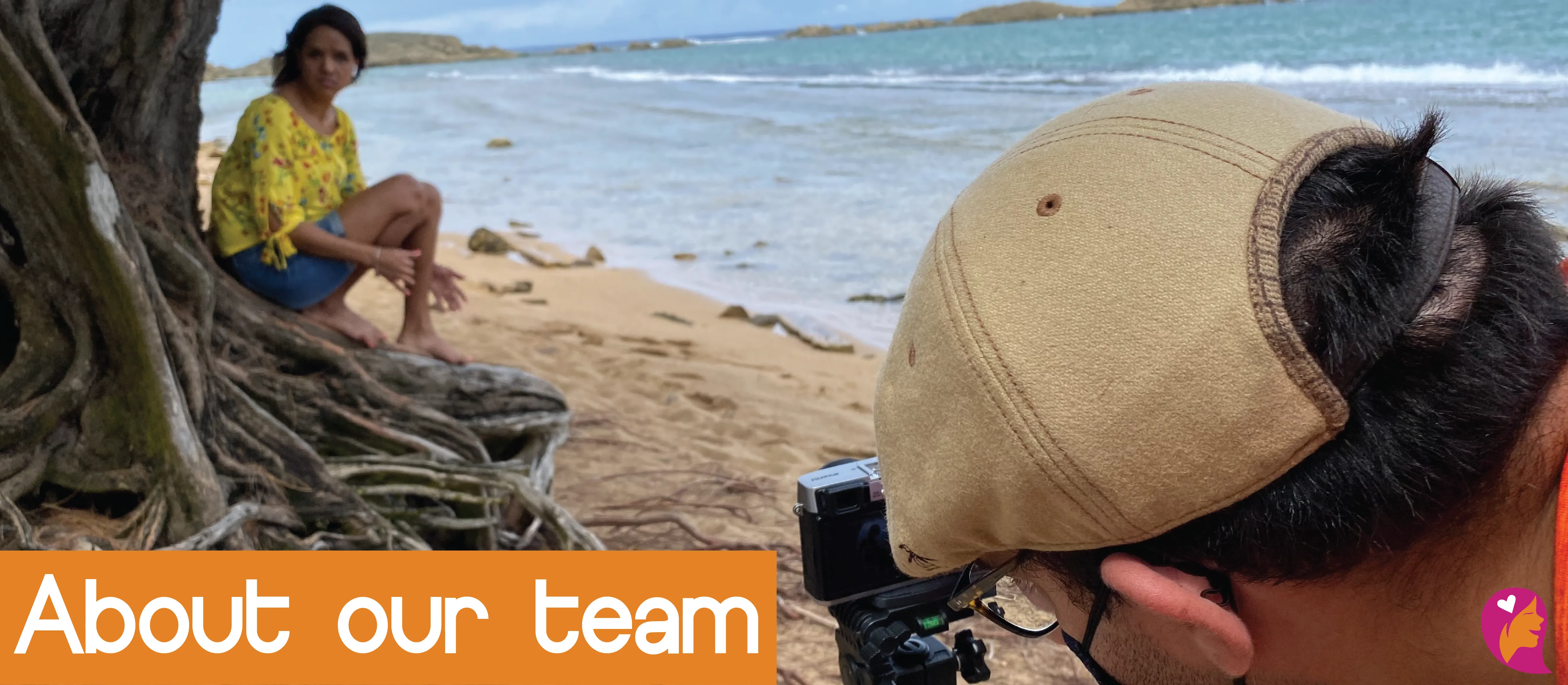 Man looking into a video camera, while Shalmarie (co-founder of GirlGround) is talking in front of it, sitting in the roots of a tree at the beach. Image reads: about our team.